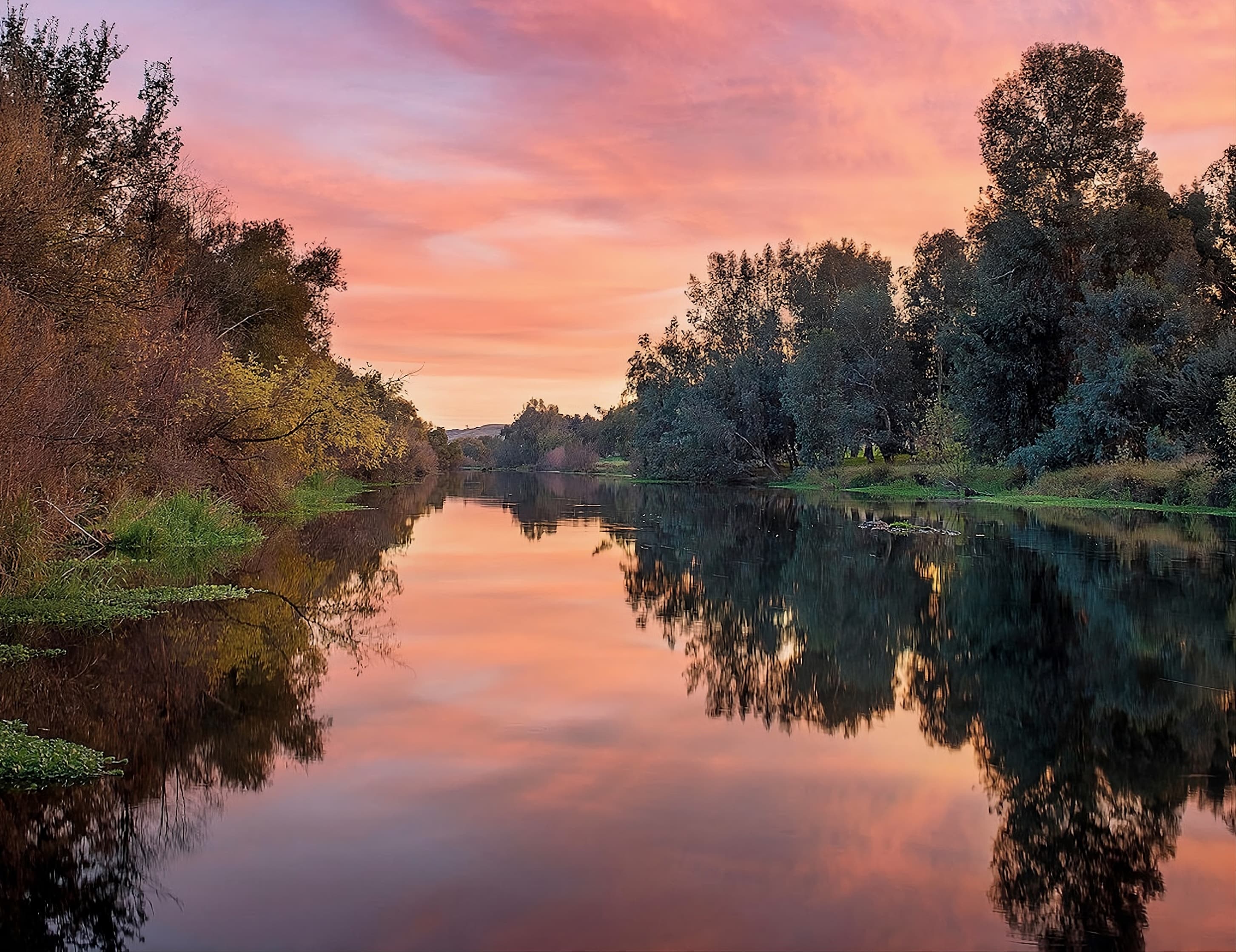 Sunset over the river on the Wild Things campus